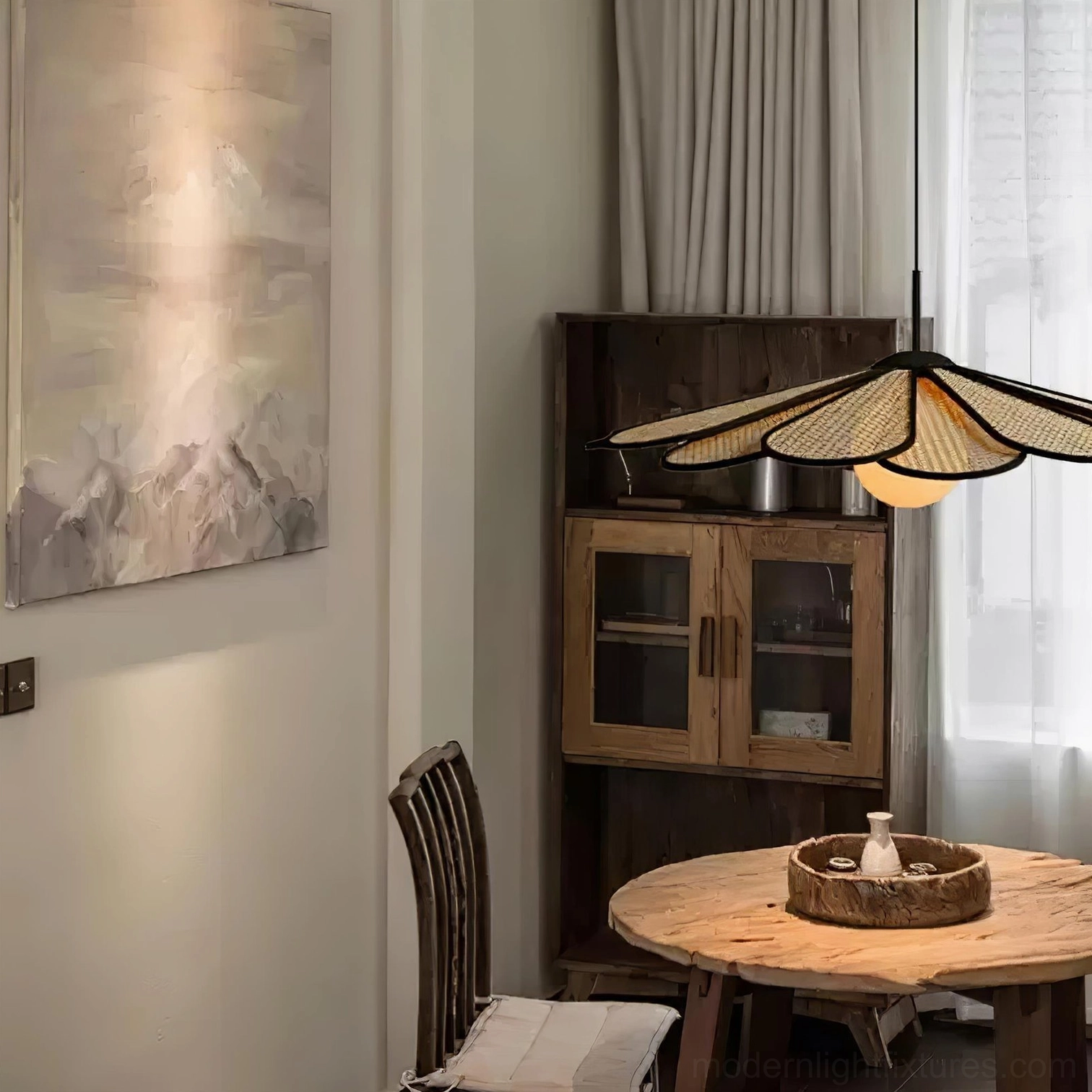 Rattan flower pendant hanging over rustic wooden dining table in warm natural bohemian home setting