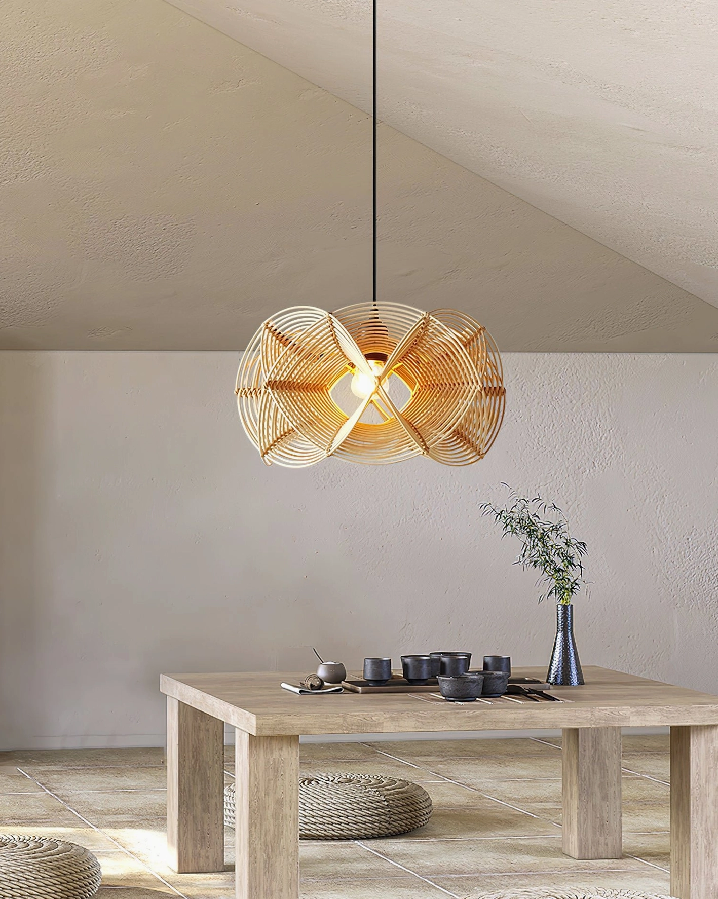 Rattan pendant lamp hanging overhead in Japanese-inspired tatami room with low wooden table and minimalist styling