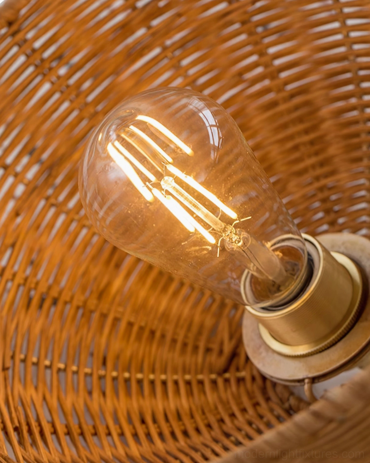 Rattan woven pendant light emitting soft ambient glow reminiscent of tropical sunlight through foliage