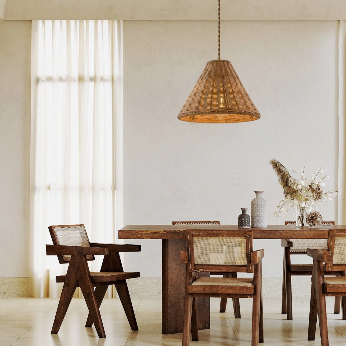 Natural woven rattan pendant light providing warm atmospheric lighting for dining and entertaining spaces