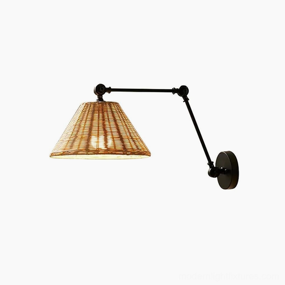 Rattan shade swing arm wall sconce in modern boho interior design setting with plants and artwork