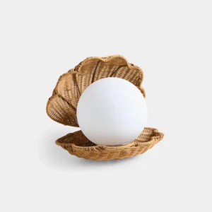 Coastal rattan seashell table lamp front view with frosted glass globe on white background