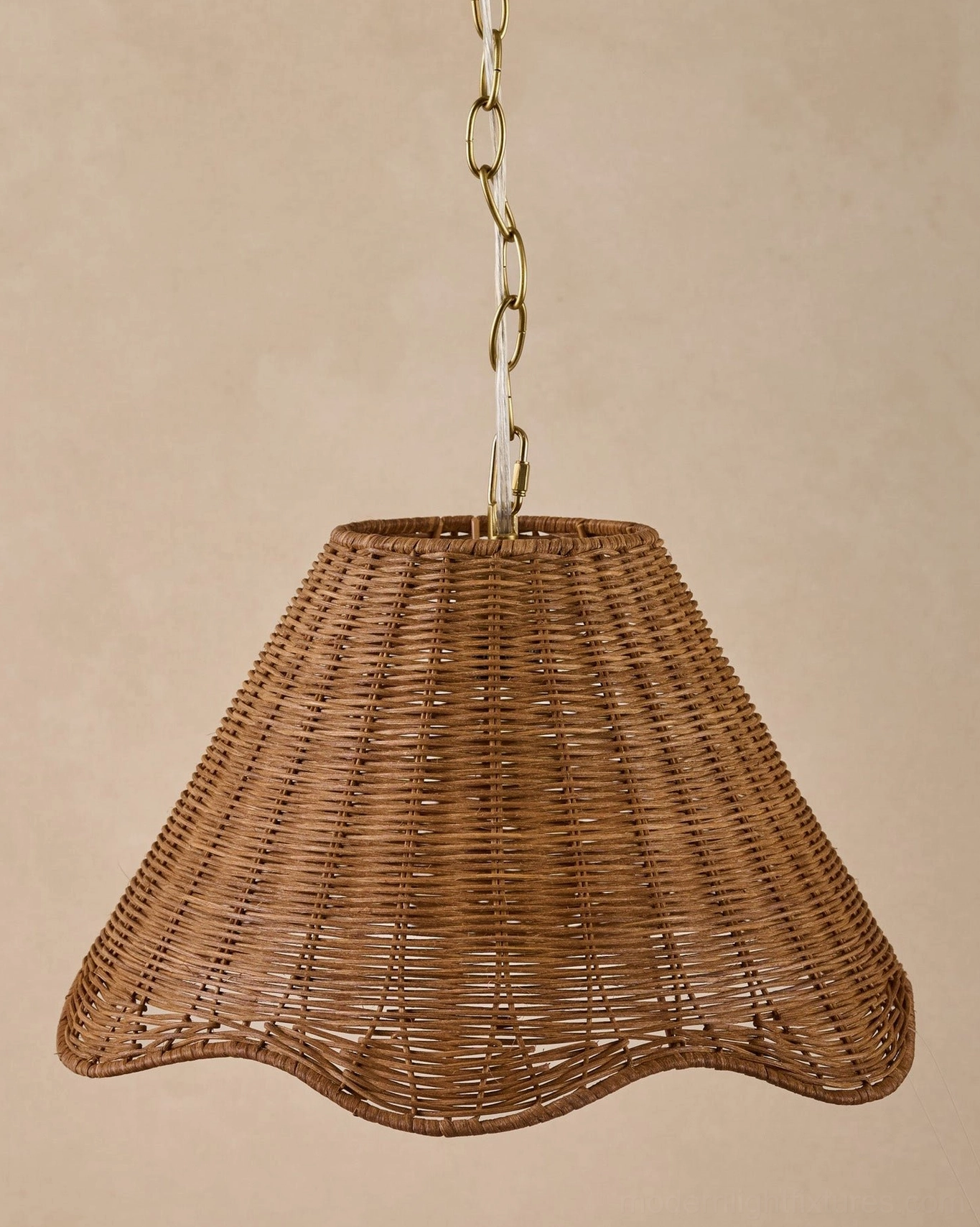 Detail view of hand-woven natural rattan shade construction with scalloped hem and open weave texture