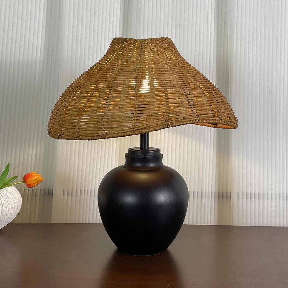 Rattan table lamp in matte black finish with hand-woven natural rattan shade, modern minimalist
