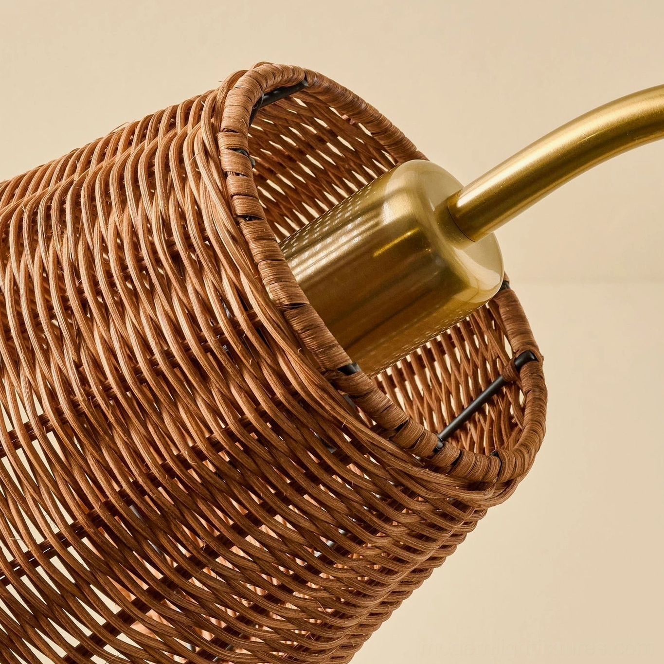Rattan table lamp base and gooseneck arm showing solid metal construction and weighted round foundation