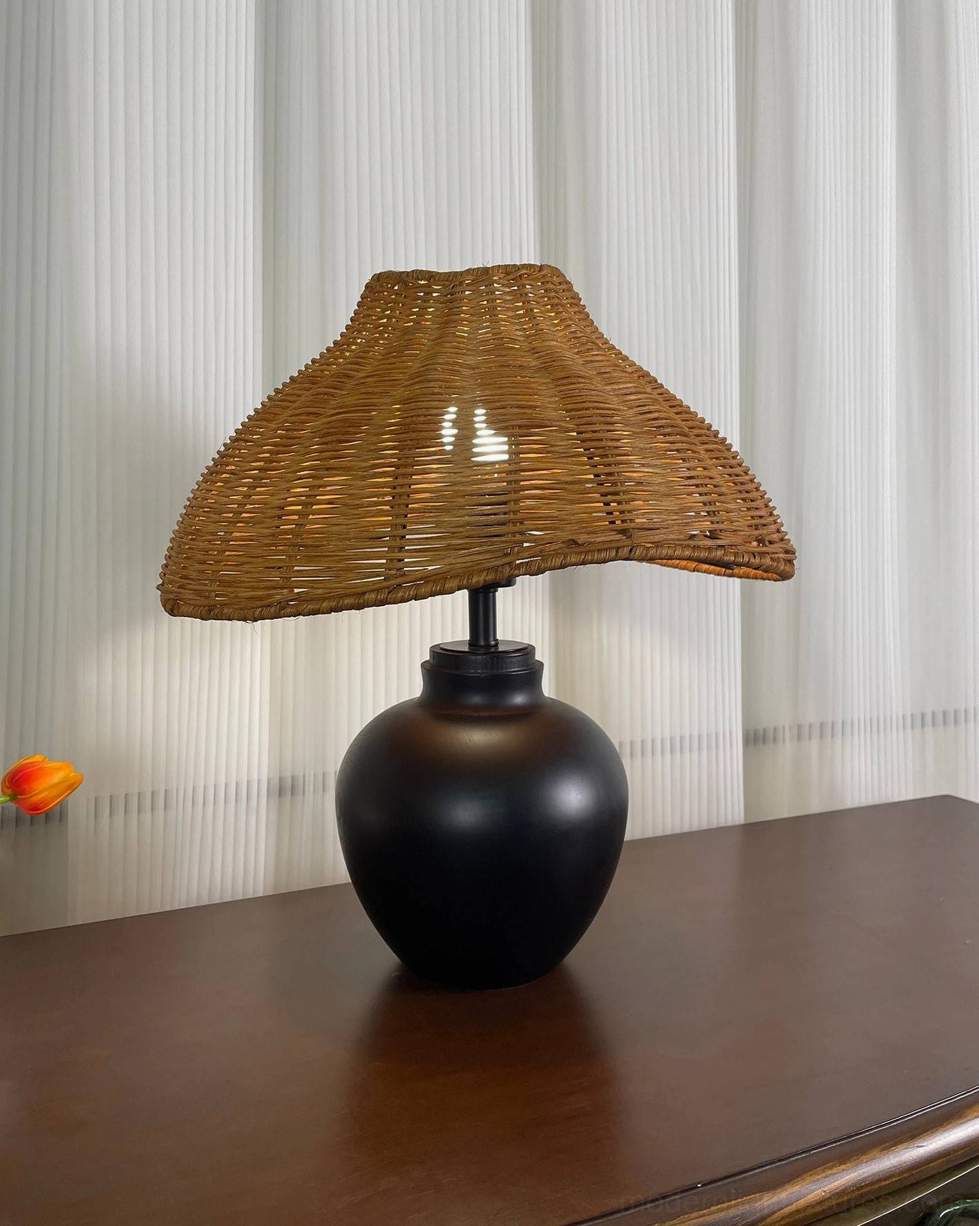 Rattan table lamp decorative lighting fixture combining organic texture with contemporary design principles