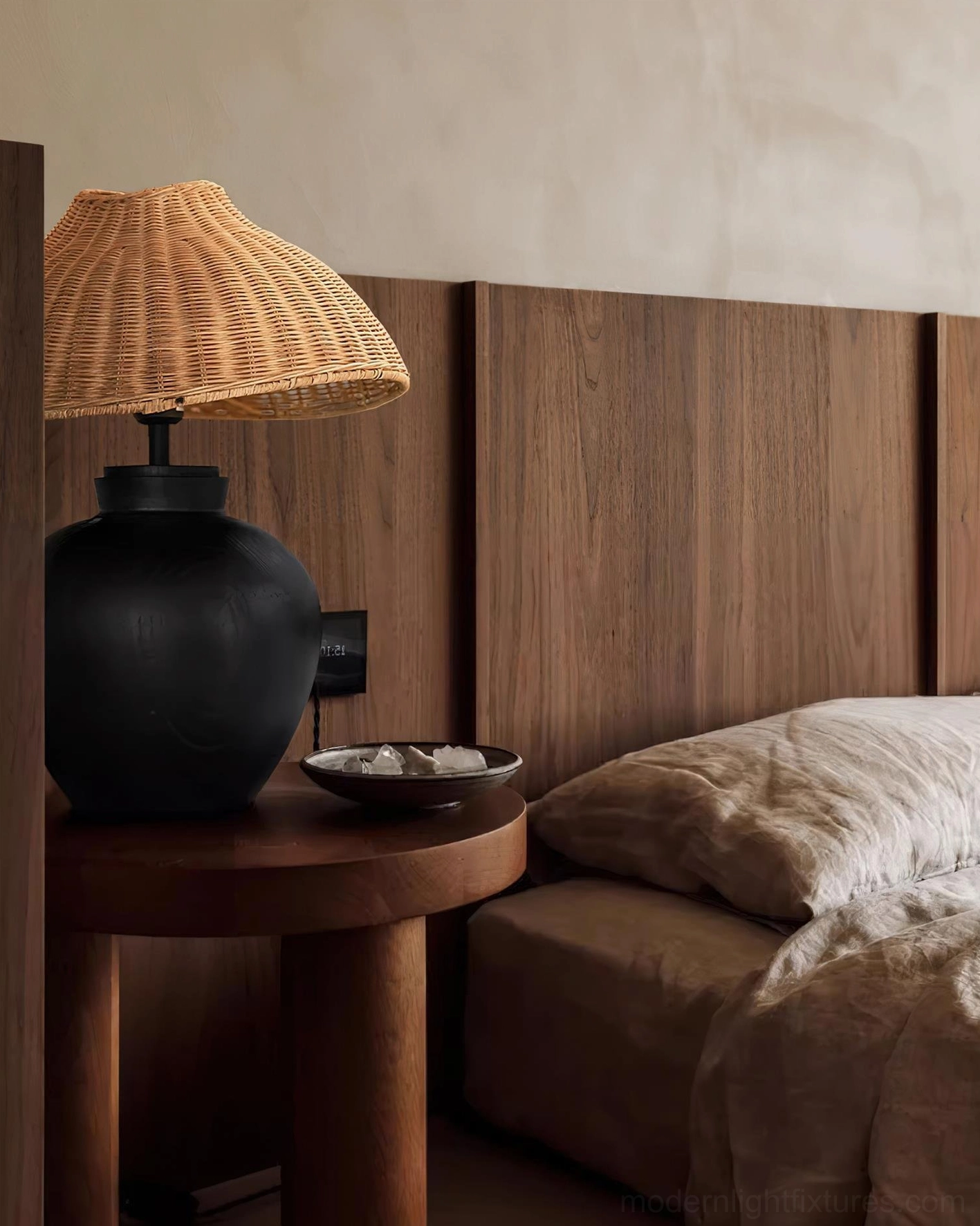 Rattan table lamp with woven shade detail showing warm dappled light diffusion and artisan craftsmanship