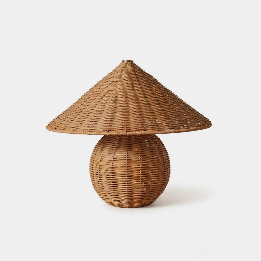 Handwoven rattan table lamp with tapered shade, front view studio shot showing detailed texture of natural woven fibers and warm brown tone
