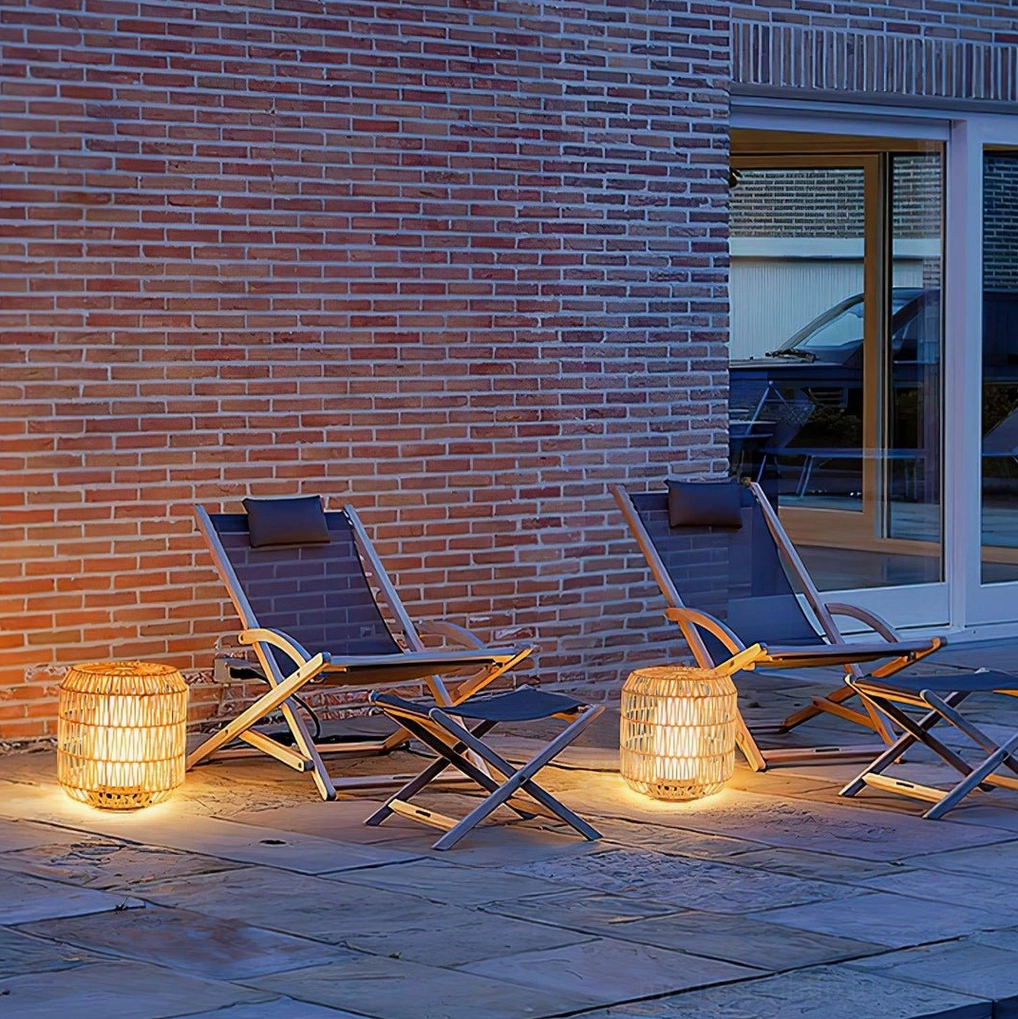 Three sizes of rattan outdoor table lamps compared showing compact medium and tall options