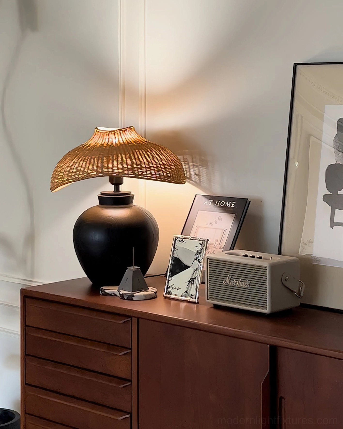 Rattan table lamp on vintage wooden dresser with retro decor elements, traditional craftsmanship aesthetic
