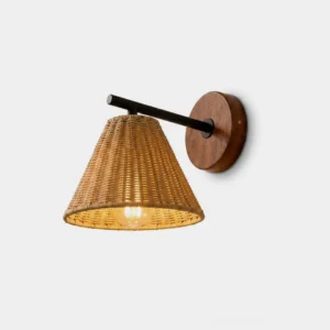 Hand-woven rattan wall sconce with black metal arm and wood backplate, front view with warm LED glow