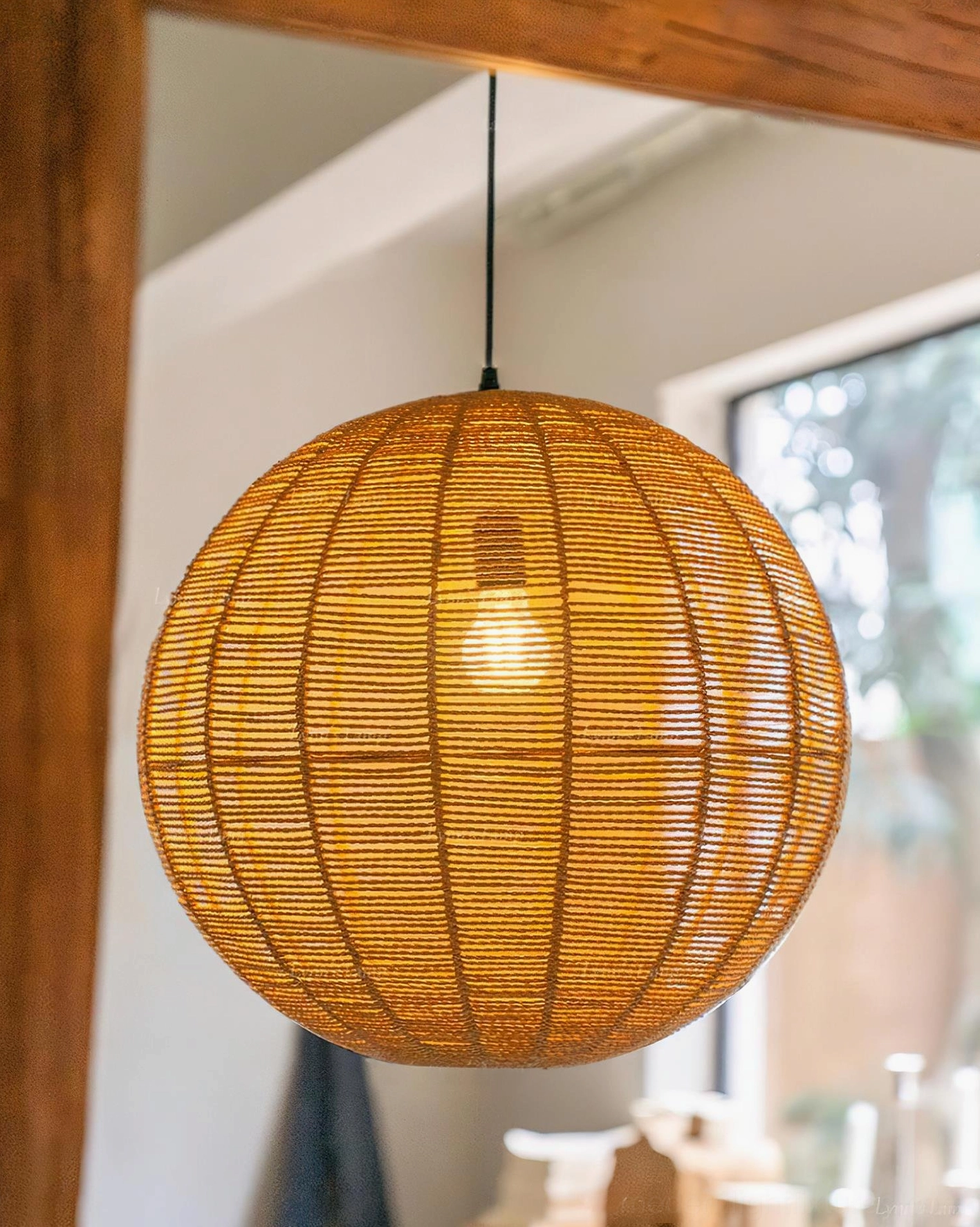 Natural rattan woven pendant light showing intricate hand-crafted weave pattern detail