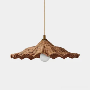 Ravela handwoven rattan wave pendant light with scalloped rim, brass canopy, front studio view showing natural woven texture