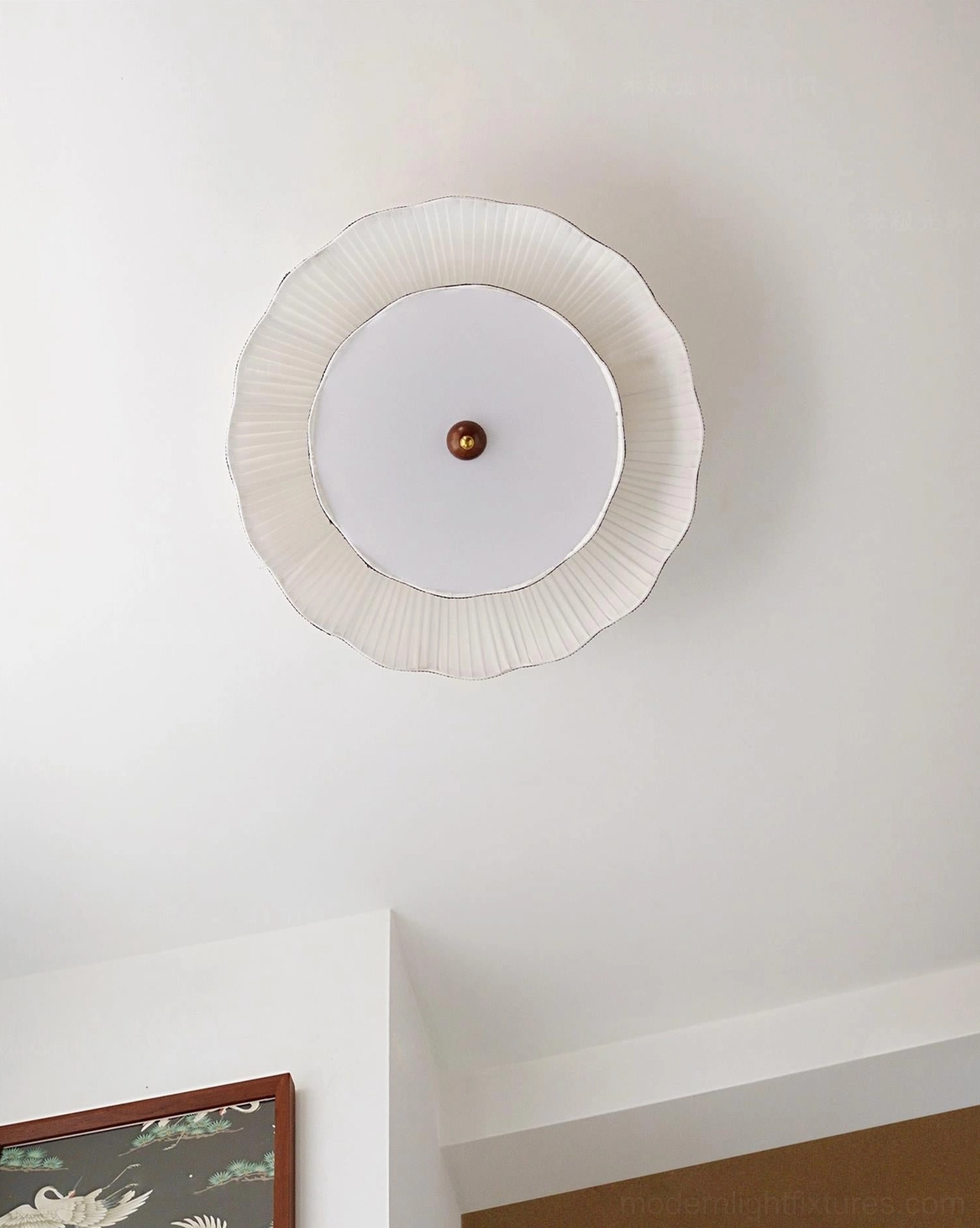 Underside view of Ravelle ceiling light fixture showing pleated fabric edge and brass central fixture