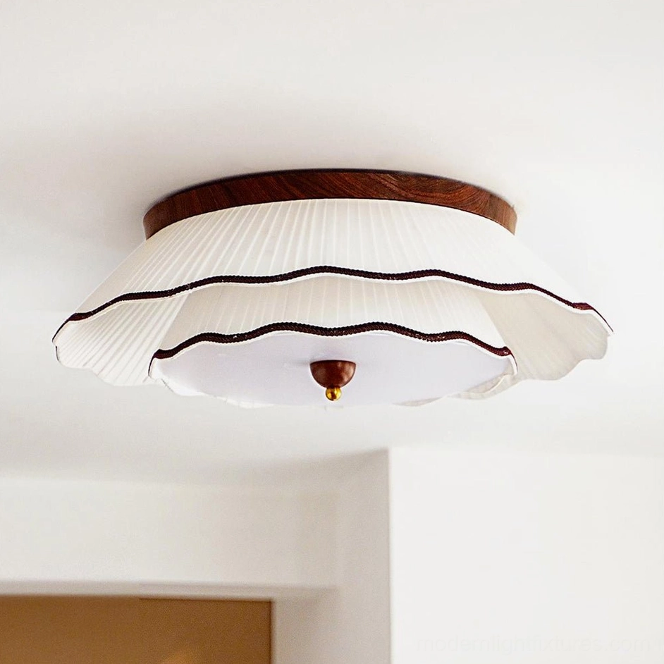 Two-tier ruffled pleated fabric ceiling lamp with dark brown trim and brass finial detail