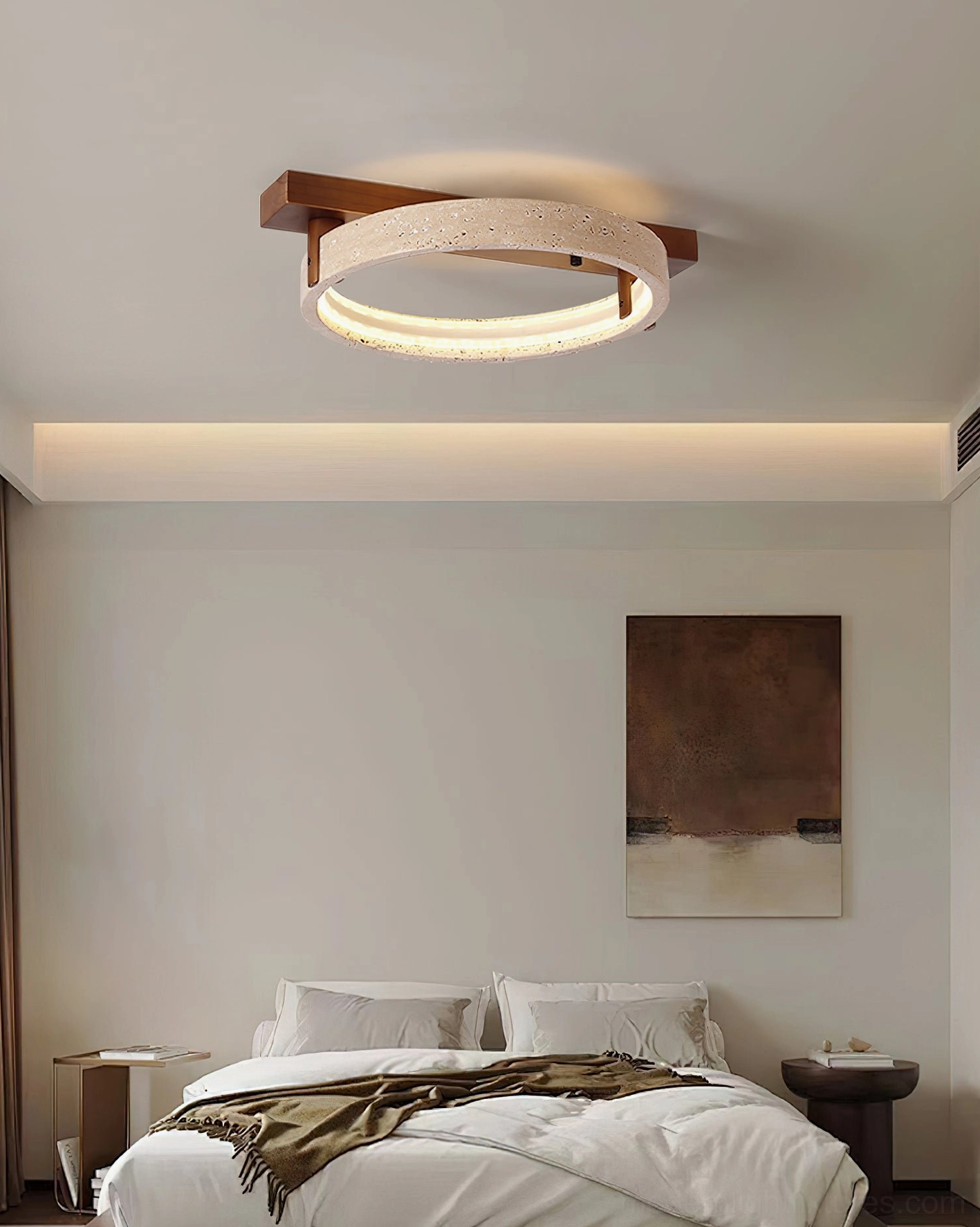 Minimalist bedroom interior with Ravelo travertine ceiling light creating warm ambient illumination above bed