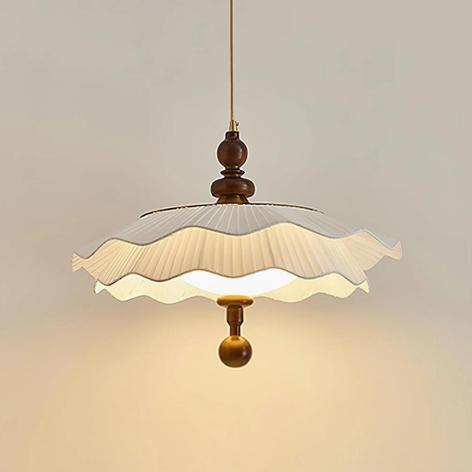 Ravina vintage pleated pendant lamp hanging with soft warm glow, three-quarter view showing pleated fabric design