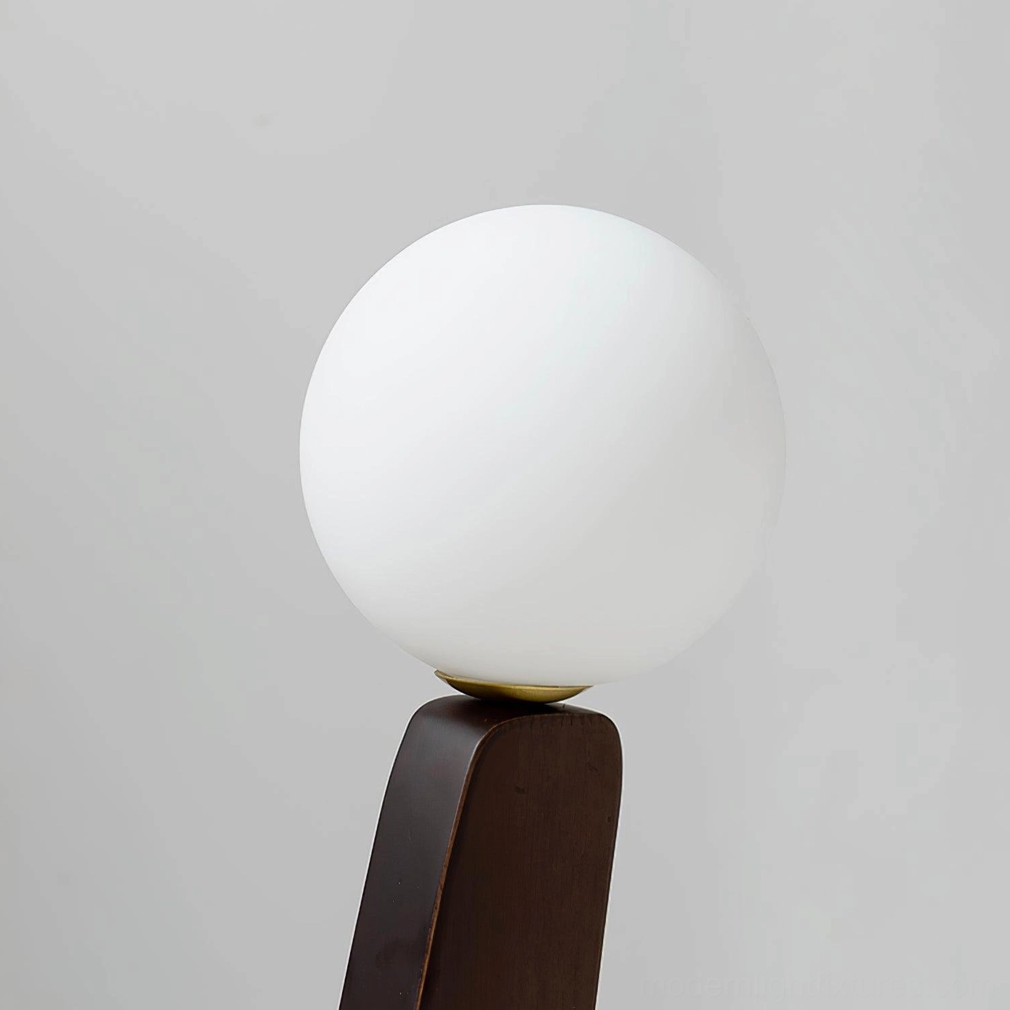 Modern reading floor lamp with frosted glass globes and handcrafted oak base in warm home setting