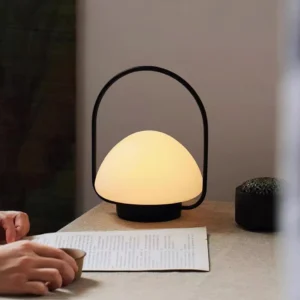 Rechargeable portable desk lamp in Nordic minimalist style, bedroom nightstand scene with warm ambient lighting