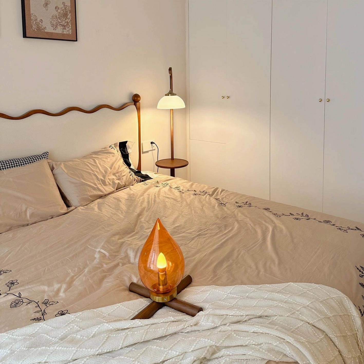 Rechargeable cordless table lamp with gold metal accents, three-quarter angle product view