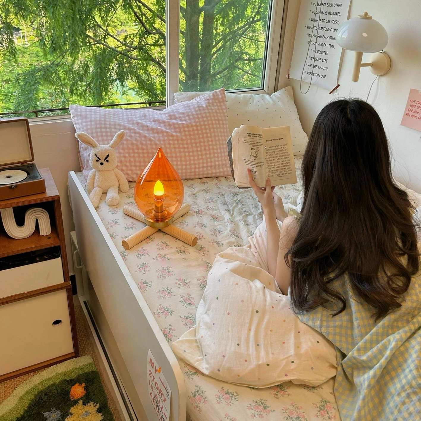 Rechargeable table lamp USB charging port detail at wooden base, cordless technology