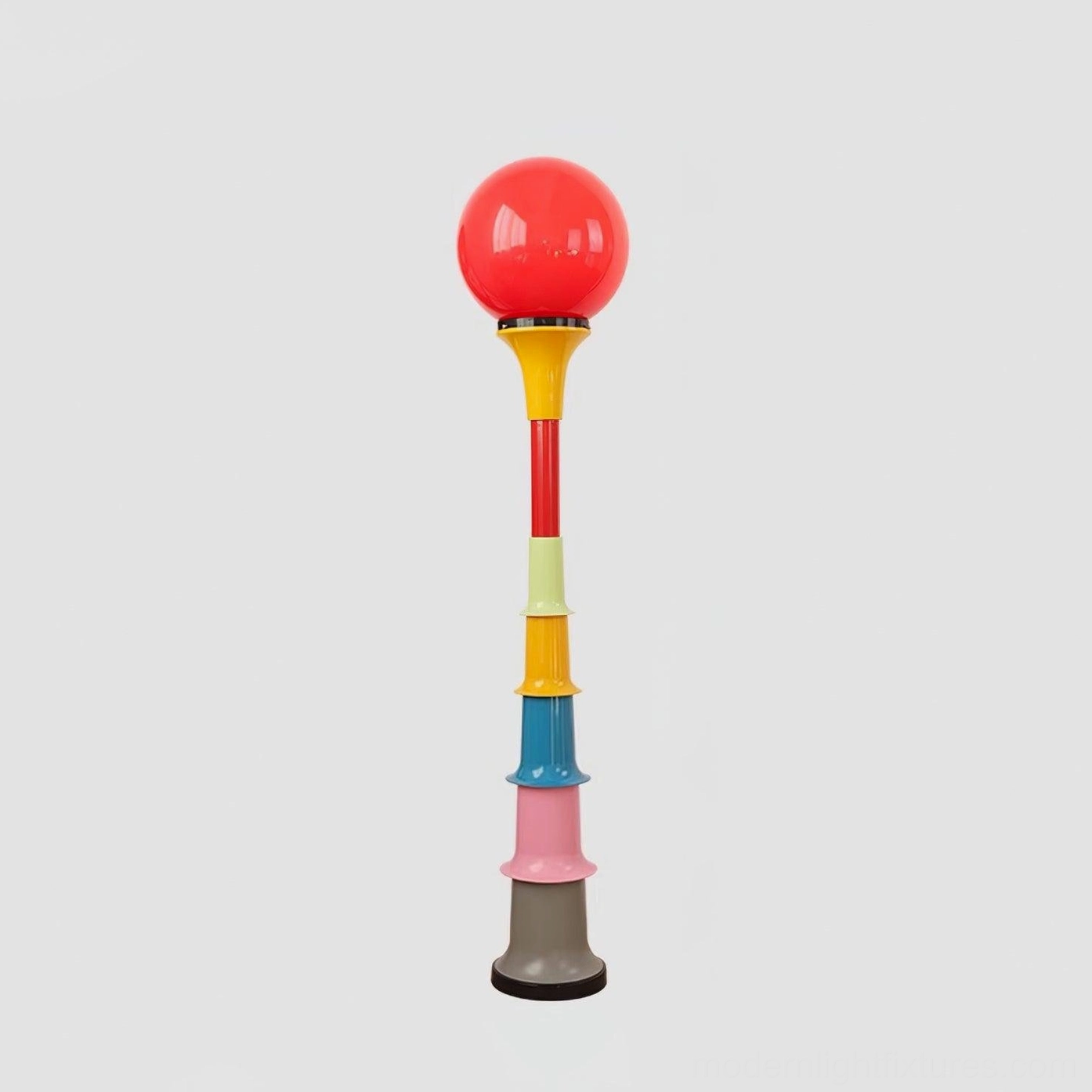 Red accent globe floor lamp with colorful stacked segments design