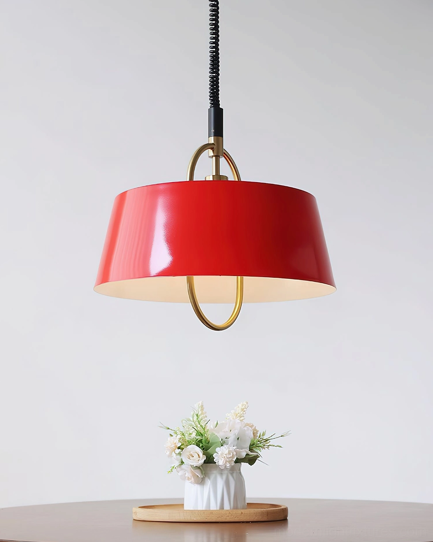 Angelo red tapered pendant lamp photographed from low angle showing geometric form and design