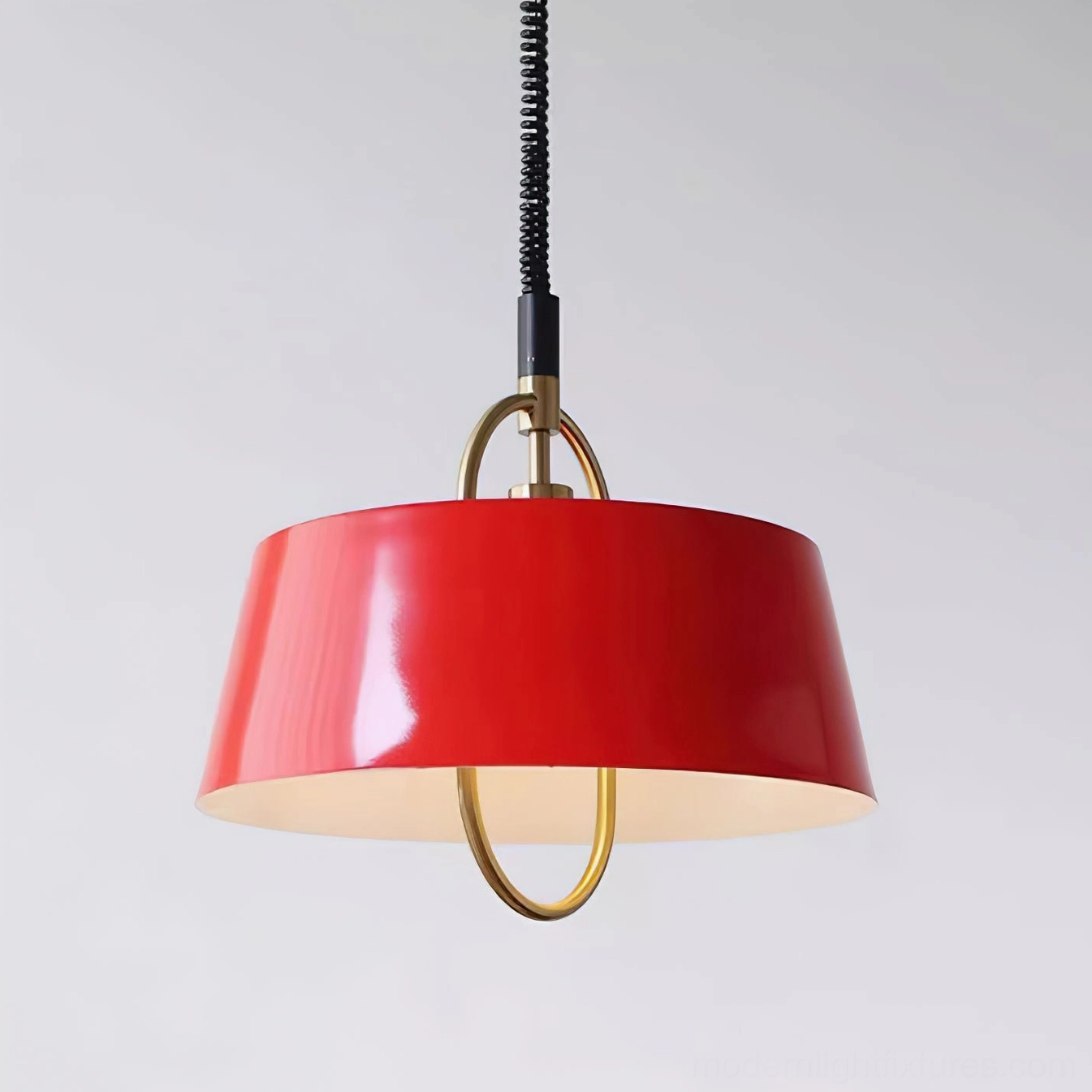 Red tapered pendant lamp with white interior diffuser and polished brass accents, three-quarter angle view