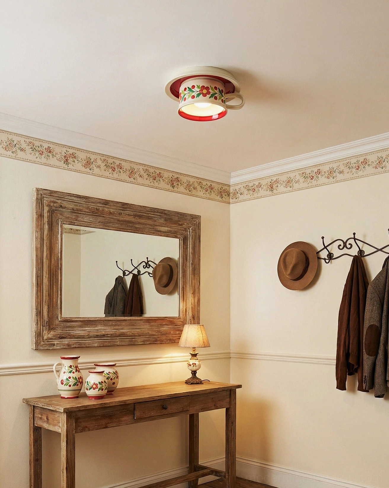 Red hand-painted ceramic tea cup ceiling lamp in farmhouse sitting area with border wallpaper, vintage mirror and country decor