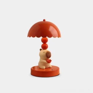 Red capybara table lamp with scalloped shade and lotus flower design, front studio view