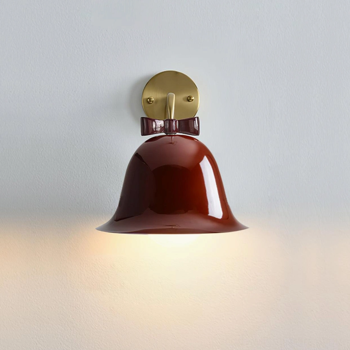 Red ceramic bell wall sconce with decorative bow knot available in contemporary modern design