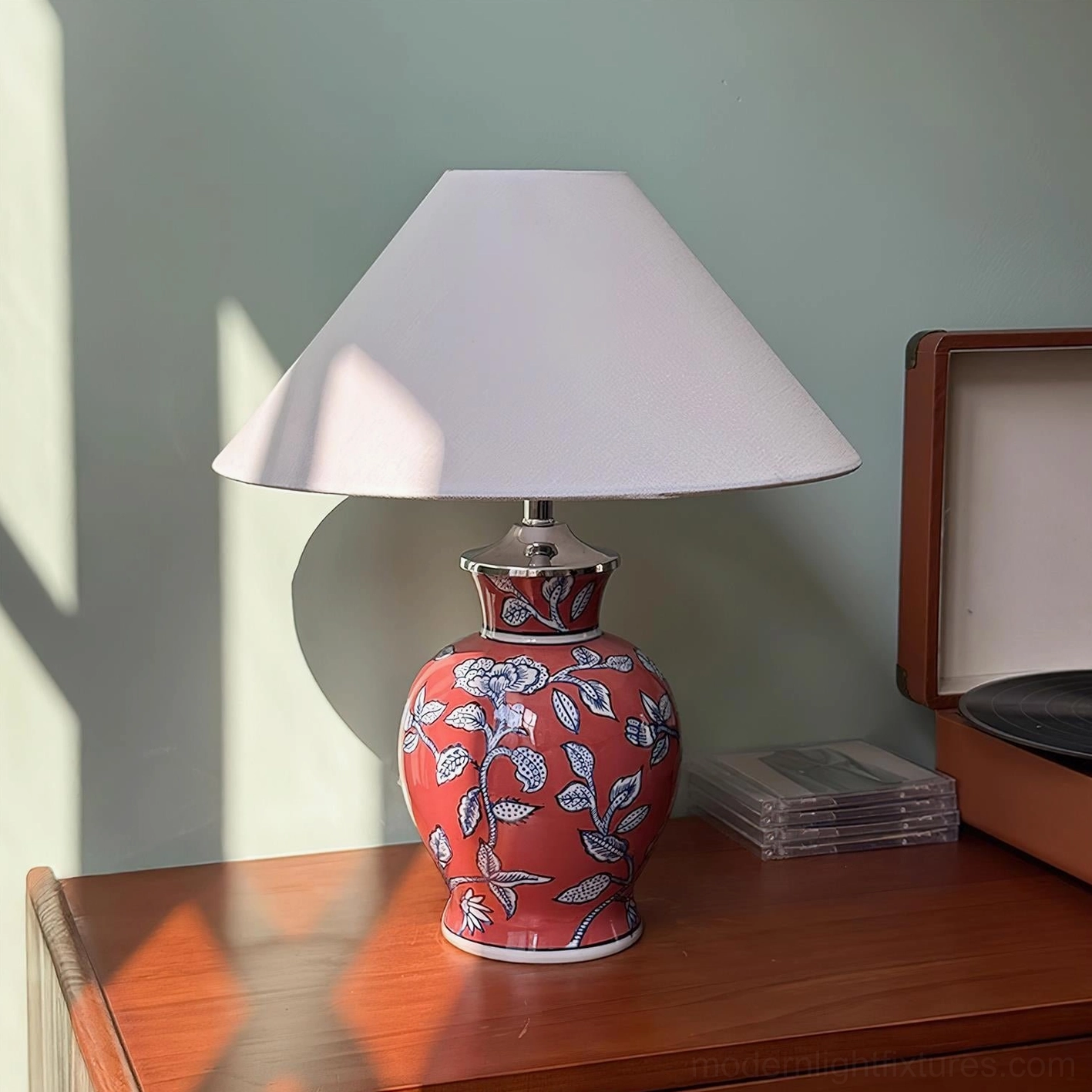 Red ceramic floral table lamp with white botanical pattern, classic oriental design style home lighting fixture