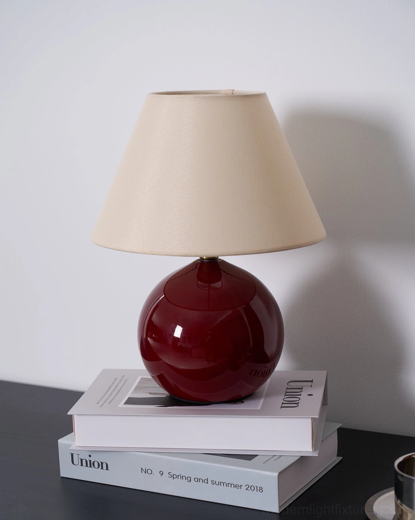 Red table lamp with neutral fabric shade contemporary home lighting accent piece