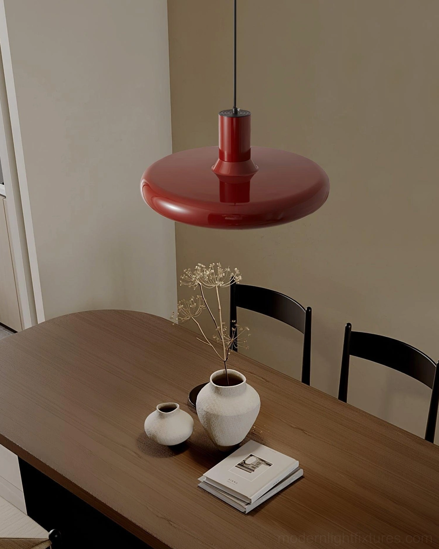 Red glossy disc pendant light dark wooden dining table sophisticated ambiance