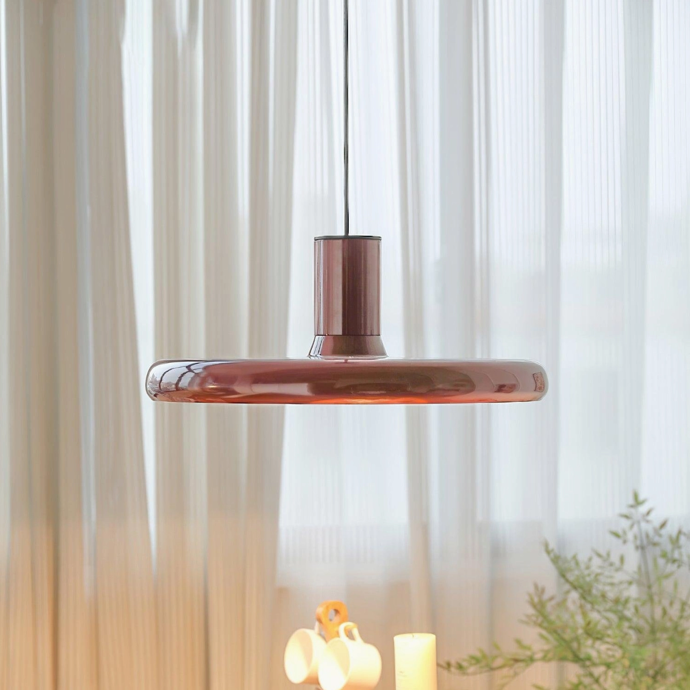 Red disc pendant light sunlit room sheer curtains glossy finish warm illumination