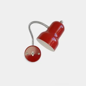 Red industrial gooseneck wall sconce with bell-shaped shade and chrome finial, flat lay top view