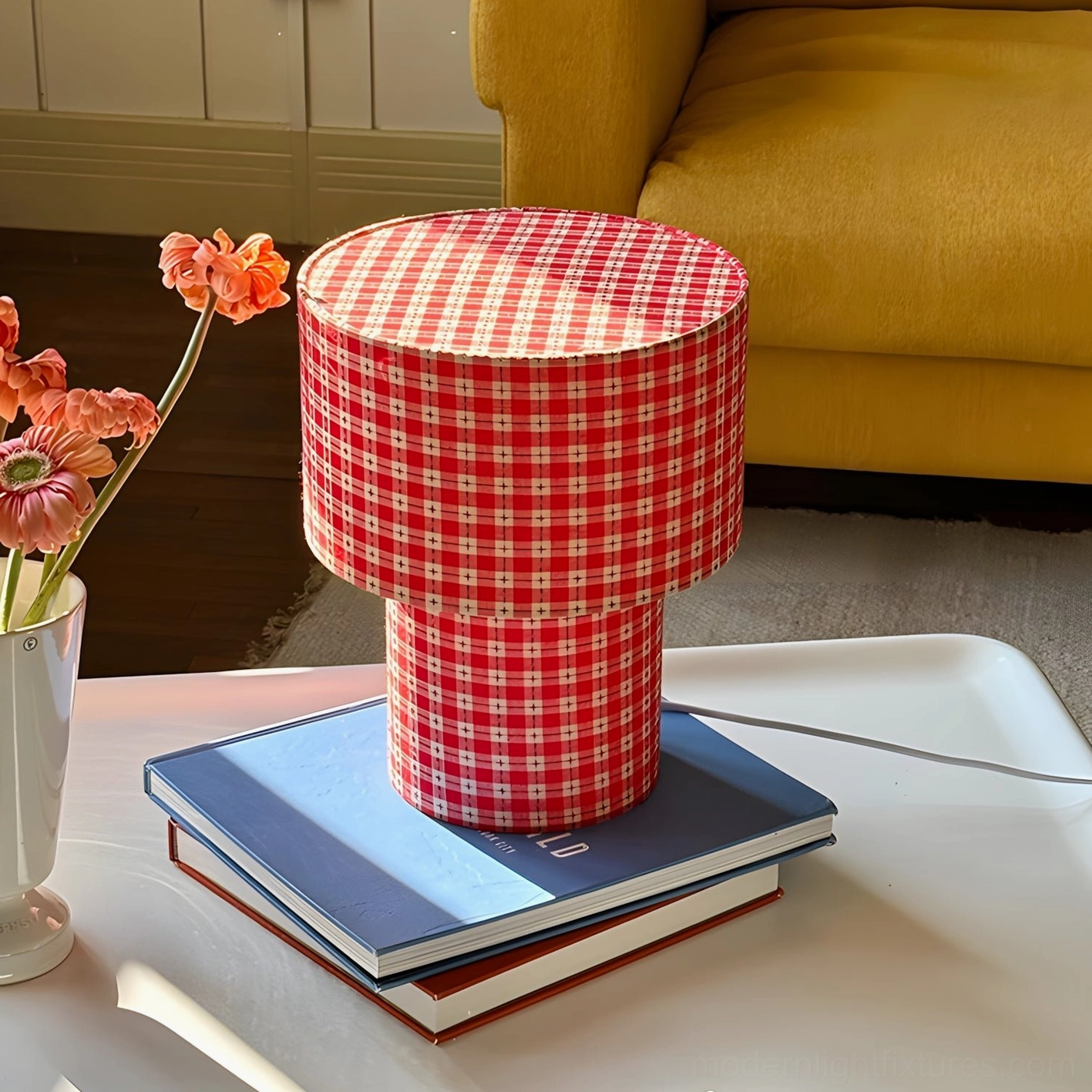 Red checkered latticefield table lamp on coffee table with flower vase and yellow sofa background