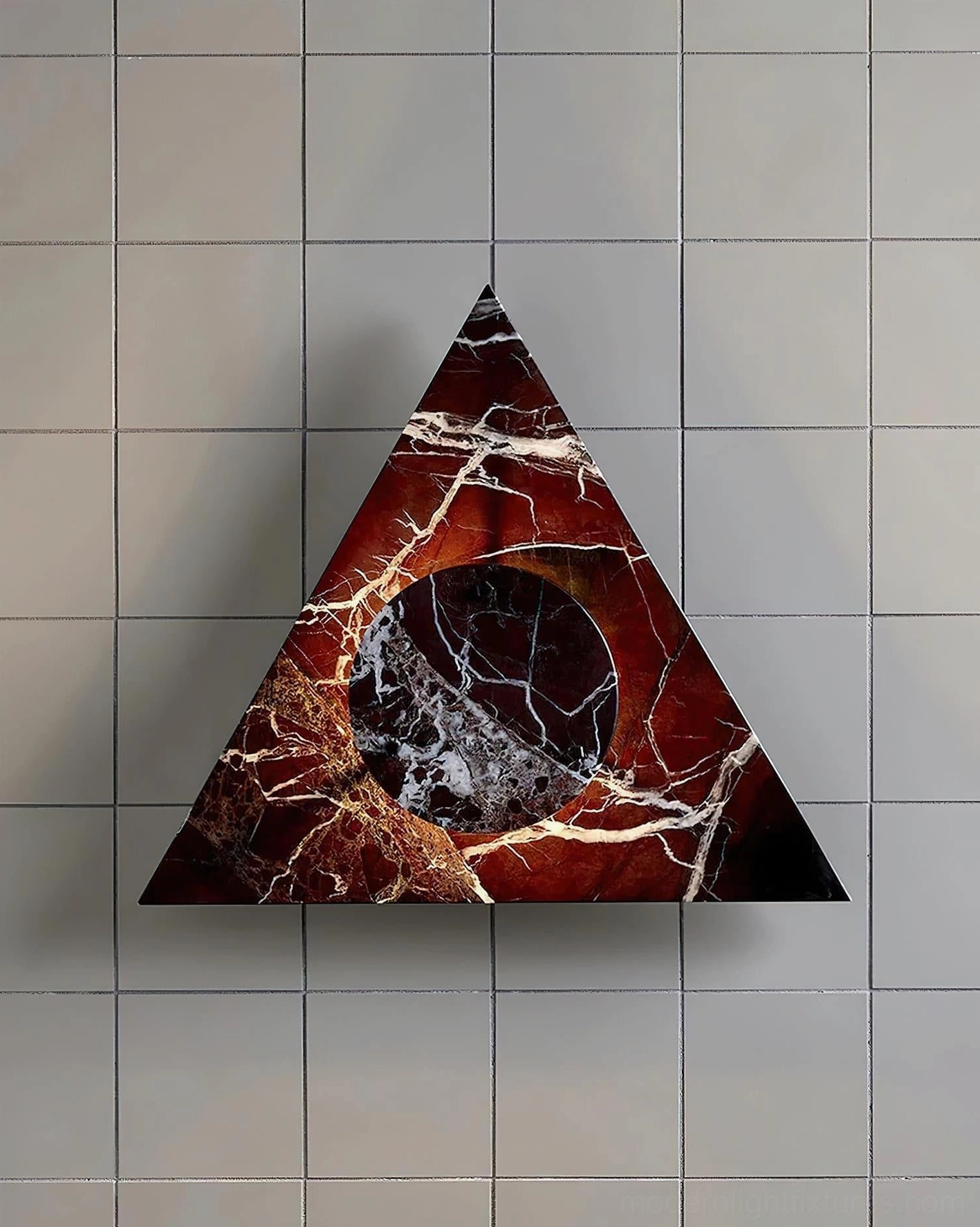 Burgundy red marble wall sconce with white veining on light gray tiled background