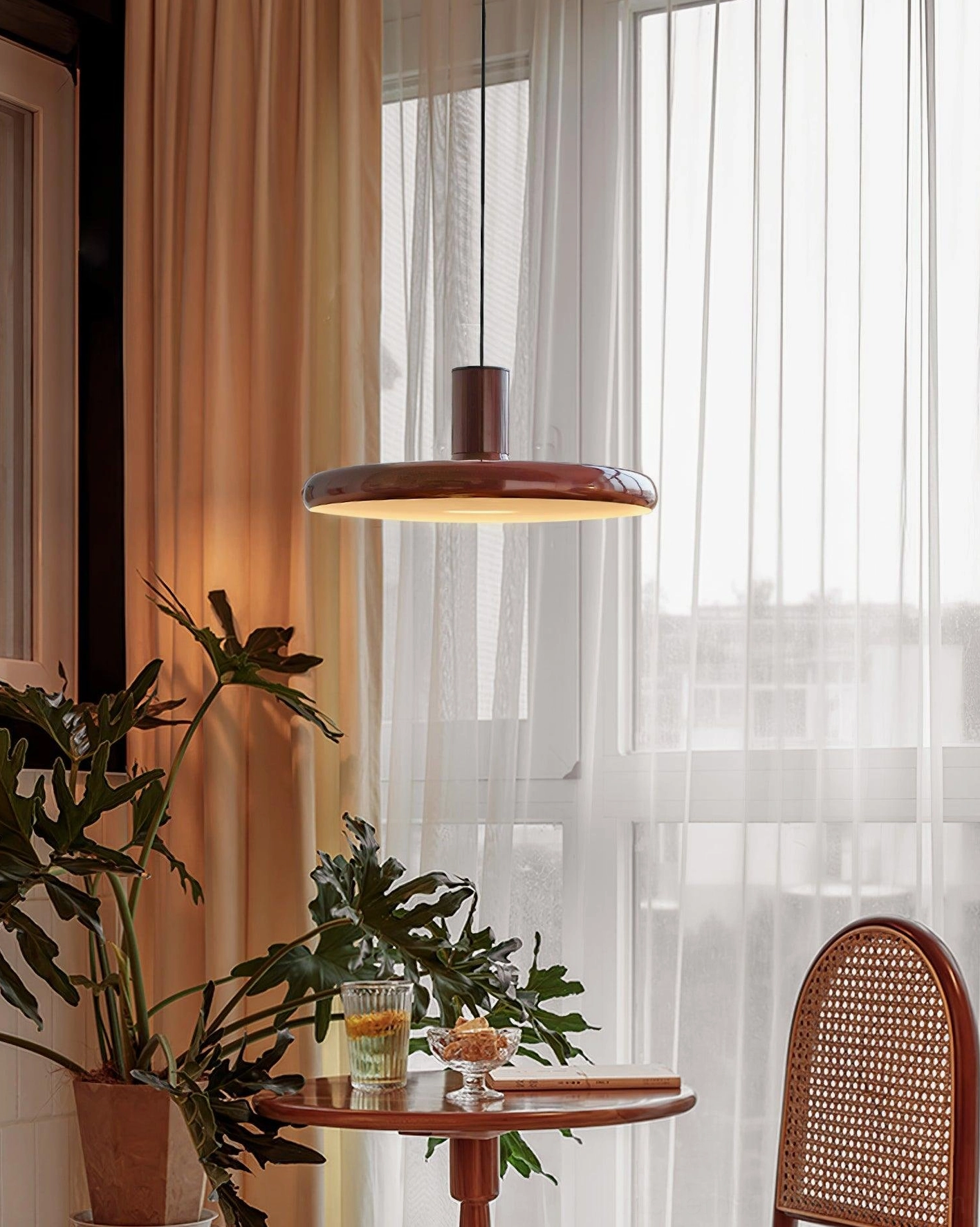 Red disc pendant light close-up glossy surface finish quality material showcase