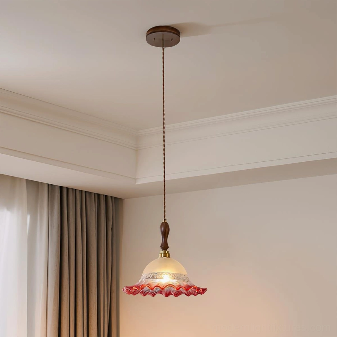 Red gradient ruffled glass pendant lamp installed on ceiling in bedroom interior