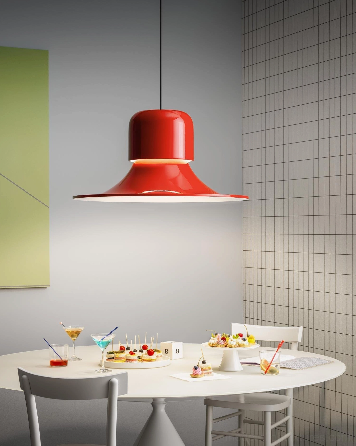 Red Nordisk pendant light installed above dining table in modern residential room