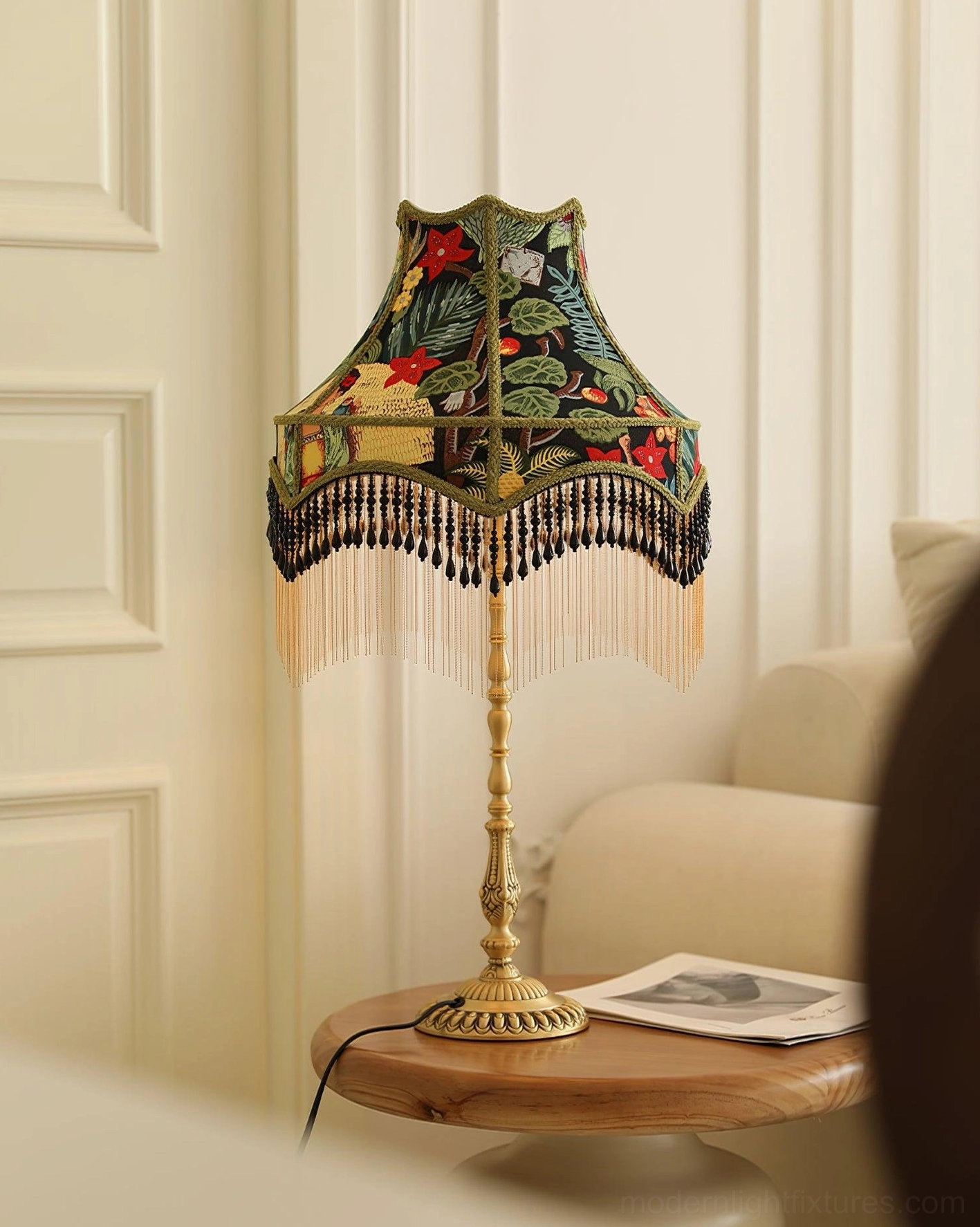 Red peony embroidered table lamp with brass base displayed in eclectic bohemian interior