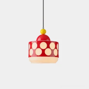 Red Popdot modern pendant light with circular cutout design hanging in studio setting, showcasing glossy finish and light diffusion pattern