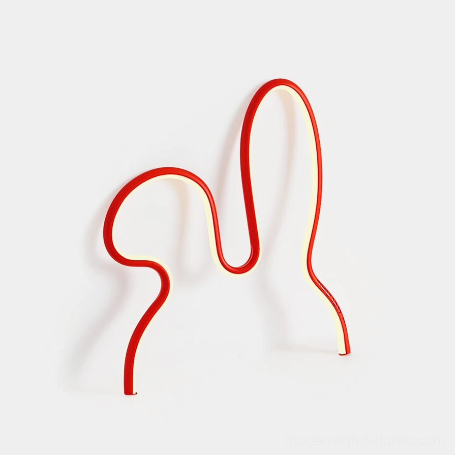 Red rabbit neon table lamp front three-quarter view with warm LED glow on white studio background