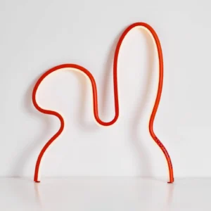 Tall red rabbit silhouette LED table lamp side front view showcasing sculptural bunny form