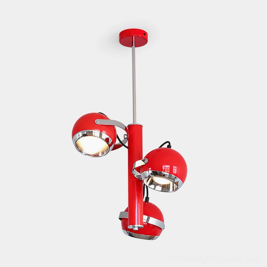 Red Sputnik pendant light with three glossy metal spherical shades and polished chrome details on white background