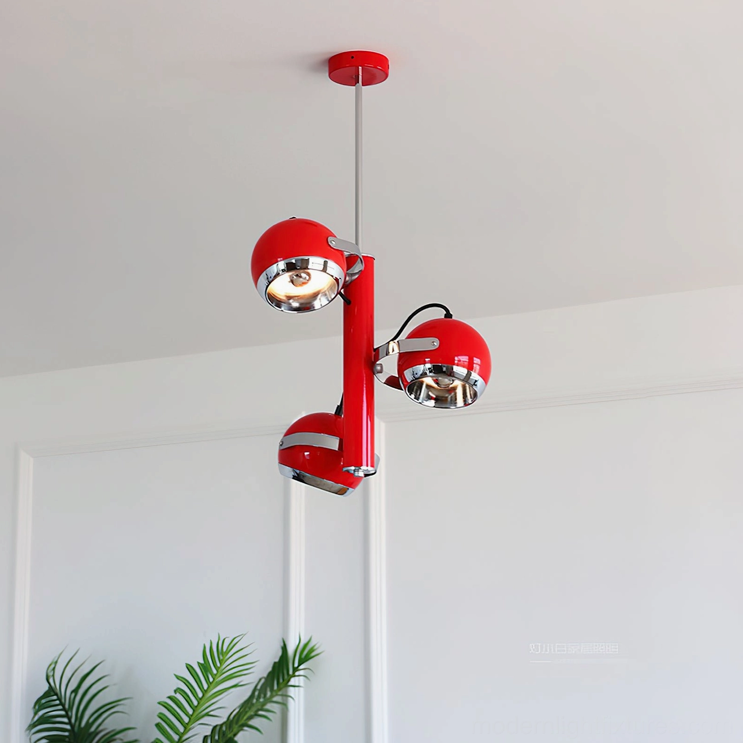 Red Sputnik atomic pendant light mounted in entryway foyer as statement fixture