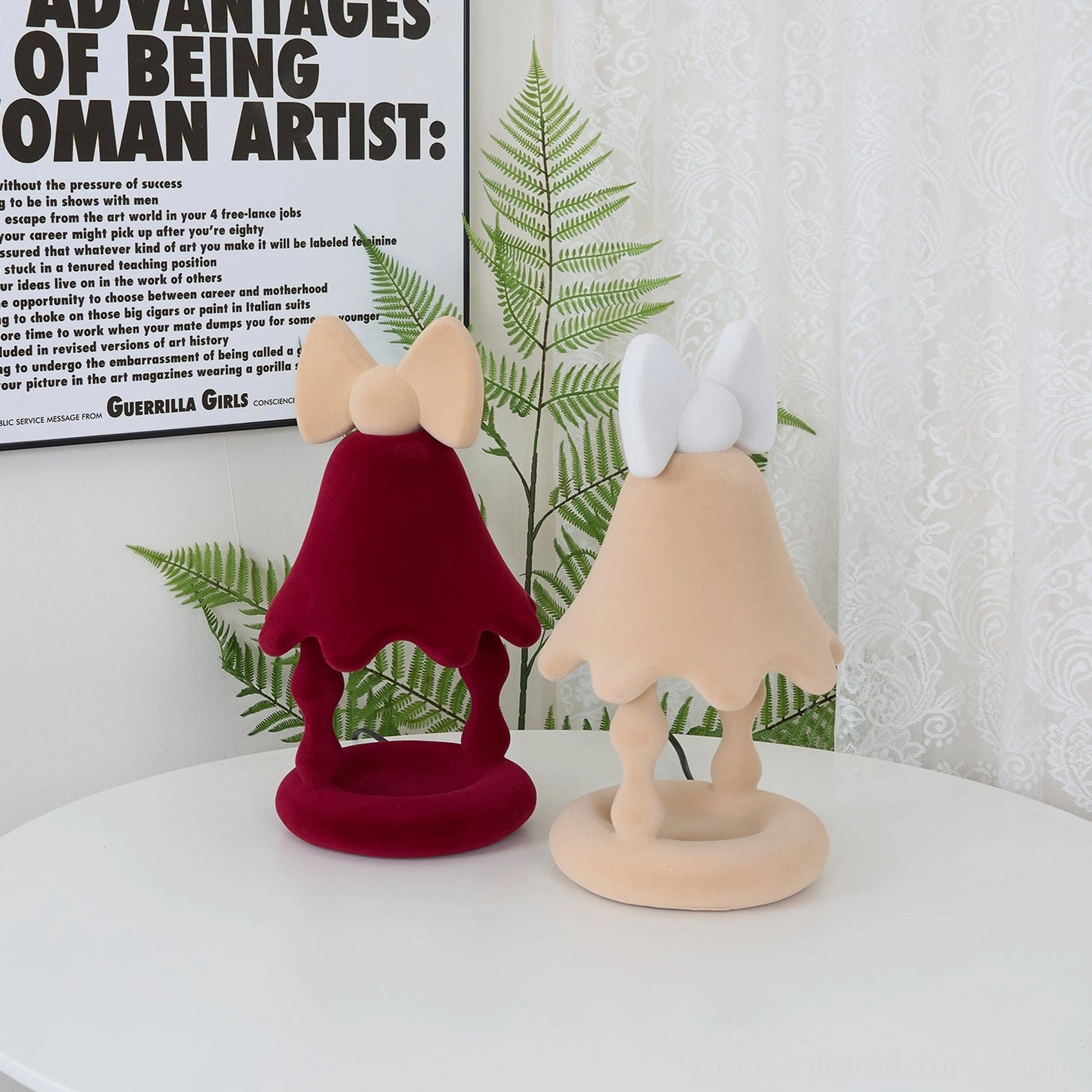 Red Stacy candle warmer lamp placed in minimalist modern home office desk setting with warm ambient lighting atmosphere
