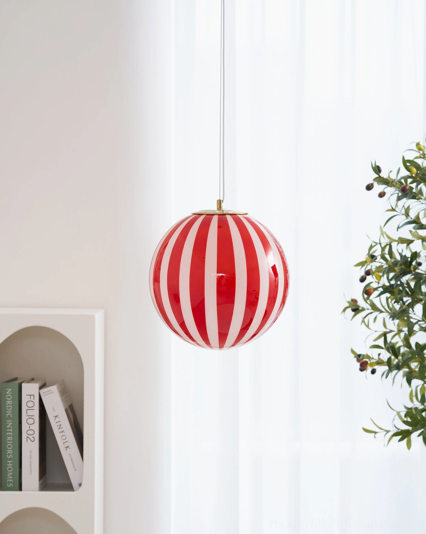 Red striped spherical pendant light showing color contrast against neutral background