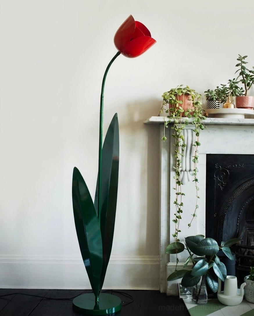 Red tulip floor lamp positioned in European living room with fireplace and green potted plants – botanical floor light in interior design